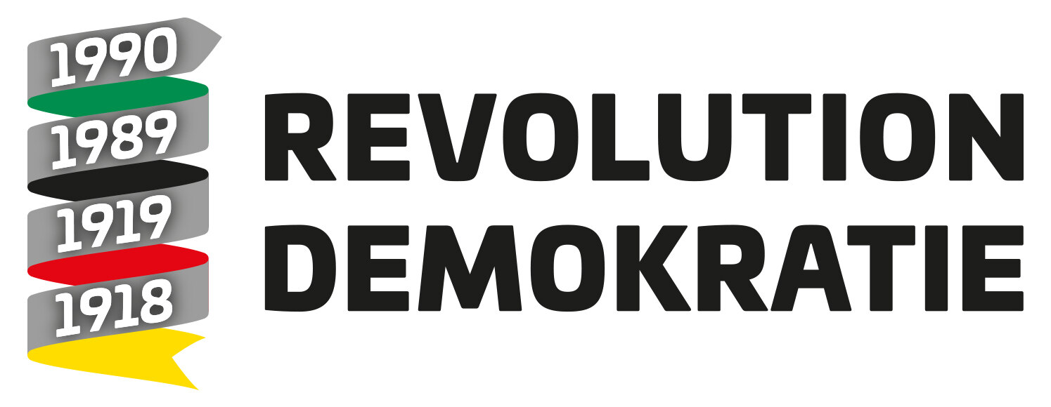 Ein Textlogo mit der Aufschrift Revolution Demokratie