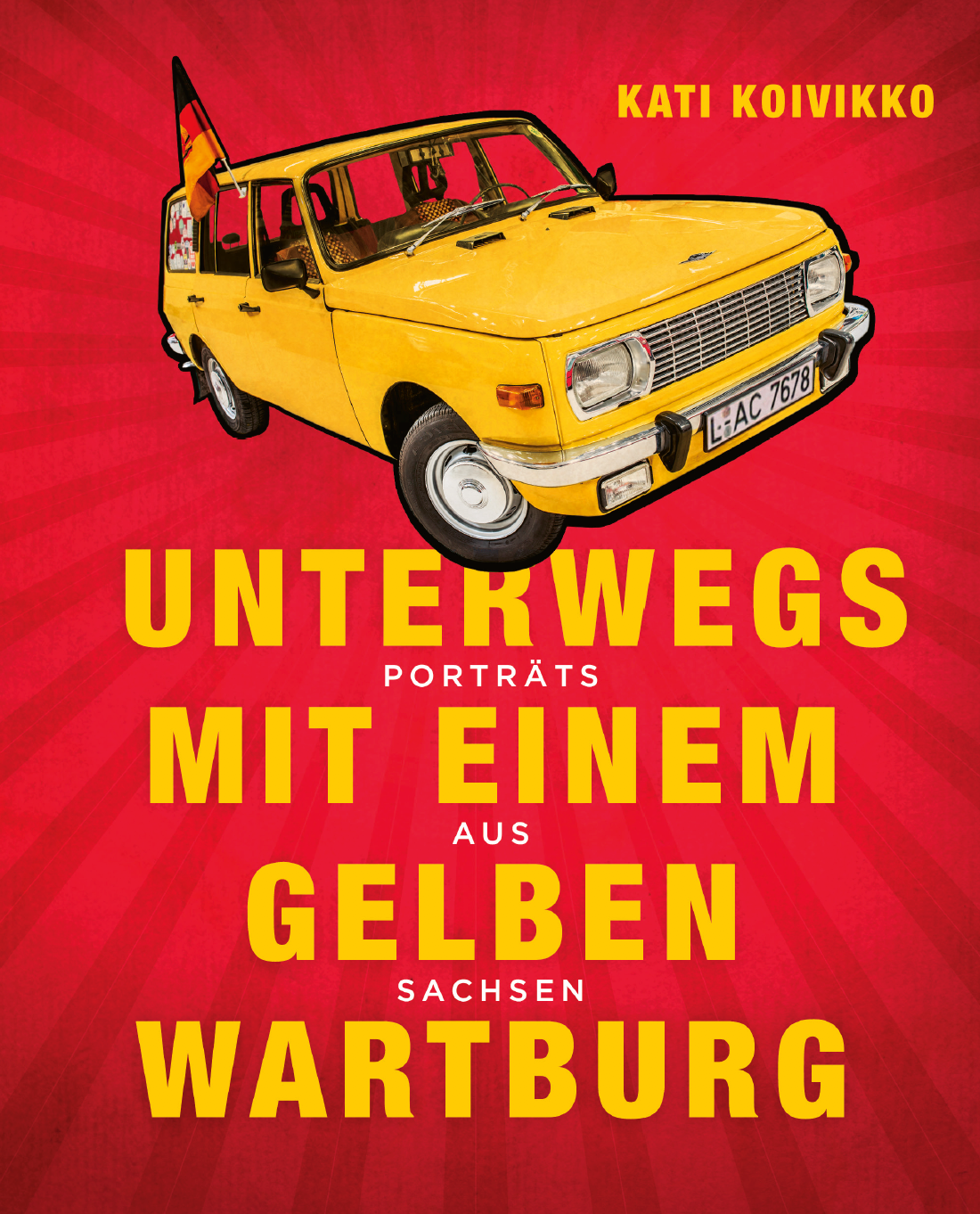 Ein gelber Wartburg vor rotem Grund.